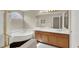 Bathroom with double vanity, soaking tub, and shower at 10914 Fintry Hills St, Las Vegas, NV 89141