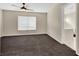 Spacious bedroom with dark carpet and ceiling fan at 10914 Fintry Hills St, Las Vegas, NV 89141