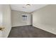 Bright bedroom featuring carpet, window, and closet at 10914 Fintry Hills St, Las Vegas, NV 89141