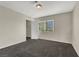 Well-lit bedroom with carpet and large window at 10914 Fintry Hills St, Las Vegas, NV 89141