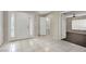 Two-story house entryway with tile floor and powder room at 10914 Fintry Hills St, Las Vegas, NV 89141