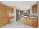 Kitchen with oak cabinets, granite counters, and stainless steel appliances at 10914 Fintry Hills St, Las Vegas, NV 89141