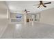 Large living room with tile floors and ceiling fans at 10914 Fintry Hills St, Las Vegas, NV 89141