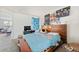 Main bedroom with a large bed and wood headboard at 2300 E Silverado Ranch Blvd # 1165, Las Vegas, NV 89183