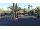 Gated community entrance with palm trees at 2300 E Silverado Ranch Blvd # 1165, Las Vegas, NV 89183
