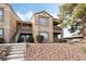 Two-story condo building with stairs and landscaping at 2300 E Silverado Ranch Blvd # 1165, Las Vegas, NV 89183
