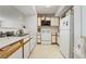 Small kitchen with white cabinets and appliances at 2300 E Silverado Ranch Blvd # 1165, Las Vegas, NV 89183