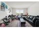 Living room with black sectional couch and coffee table at 2300 E Silverado Ranch Blvd # 1165, Las Vegas, NV 89183