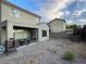 Landscaped backyard with patio and covered seating area at 2749 Invermark St, Henderson, NV 89044