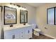 Elegant bathroom with double vanity, large mirrors, and updated fixtures at 578 Cervantes Dr, Henderson, NV 89014