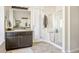 Modern bathroom with a walk-in shower and granite countertop at 2012 Poetry Ave, Henderson, NV 89052