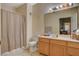Clean bathroom with a shower/tub combo and wood vanity at 9580 W Reno Ave # 238, Las Vegas, NV 89148