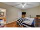 Spacious bedroom with wood floors, ceiling fan, and a view of the bathroom at 9580 W Reno Ave # 238, Las Vegas, NV 89148