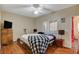 Bright bedroom with wood floors, ceiling fan, and lots of natural light at 9580 W Reno Ave # 238, Las Vegas, NV 89148