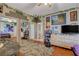 Second bedroom with mirrored closet doors and a view of the bathroom at 9580 W Reno Ave # 238, Las Vegas, NV 89148