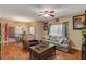 Bright living room features hardwood floors, comfy seating, and access to the dining area at 9580 W Reno Ave # 238, Las Vegas, NV 89148