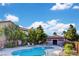 Community pool with lounge chairs and equipment storage at 9580 W Reno Ave # 238, Las Vegas, NV 89148