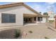 Covered patio and gravel backyard with mature desert landscaping at 5240 Las Cruces Dr, Las Vegas, NV 89130