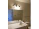 Bright bathroom featuring a vanity with a single sink, mirror, and tiled flooring at 2004 Mesquite Ln # 201, Laughlin, NV 89029