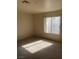 Bright bedroom with carpeted floors and large window letting in natural light at 2004 Mesquite Ln # 201, Laughlin, NV 89029