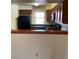 Functional kitchen with wood cabinets and a window providing natural light at 2004 Mesquite Ln # 201, Laughlin, NV 89029