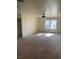 Spacious living room with abundant light from a large window and ceiling fan at 2004 Mesquite Ln # 201, Laughlin, NV 89029