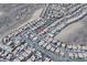 An aerial view showcases a desert community with closely-packed homes and streets, highlighting the neighborhood layout and location at 2804 Josephine Dr, Henderson, NV 89044