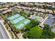 Aerial view of community featuring tennis and basketball courts, lush landscaping, and walking paths at 2804 Josephine Dr, Henderson, NV 89044