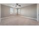 A bright and airy bedroom with neutral carpet, a ceiling fan, and plantation shutters at 2804 Josephine Dr, Henderson, NV 89044