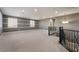 Upstairs bonus room with neutral carpet and railing overlooking the entry way at 2804 Josephine Dr, Henderson, NV 89044