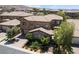 Beautiful two-story home with lush landscaping, tile roof, and brick driveway at 2804 Josephine Dr, Henderson, NV 89044