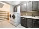 Laundry room featuring a washing machine, dryer, and extra storage space at 2804 Josephine Dr, Henderson, NV 89044