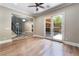 Spacious living room features a ceiling fan, wood floors, with a glass door leading to a patio at 2804 Josephine Dr, Henderson, NV 89044
