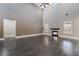 Spacious living room featuring dark wood floors, a fireplace, and large windows at 2804 Josephine Dr, Henderson, NV 89044