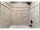 A fully-tiled shower with a rainfall showerhead and modern fixtures at 2804 Josephine Dr, Henderson, NV 89044