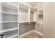 Walk-in closet featuring built-in shelves and hanging rods for ample storage space at 2804 Josephine Dr, Henderson, NV 89044