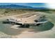 Large riding arena with spectator seating at 9381 S Homestead Rd, Pahrump, NV 89061