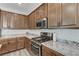 Modern kitchen featuring granite countertops and stainless steel appliances at 2796 Sipe Springs St, Las Vegas, NV 89142