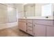 This bathroom offers a double vanity and a shower with sliding doors at 3843 Terrazzo Ave # 0, Las Vegas, NV 89115