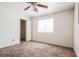 This cozy bedroom features a ceiling fan, closet, and bright window at 3843 Terrazzo Ave # 0, Las Vegas, NV 89115