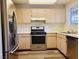 Modern kitchen with stainless steel appliances and ample counter space for cooking at 3843 Terrazzo Ave # 0, Las Vegas, NV 89115