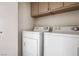Laundry room with a washer and dryer and cabinets at 3843 Terrazzo Ave # 0, Las Vegas, NV 89115
