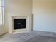 Spacious living room featuring a fireplace and lots of natural light from a nearby window at 3843 Terrazzo Ave # 0, Las Vegas, NV 89115