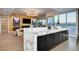 Modern kitchen with marble island, dark cabinetry, and city views at 4525 Dean Martin Dr # 2406, Las Vegas, NV 89103