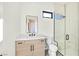 Clean bathroom with modern vanity, toilet, and glass-enclosed shower at 6615 Whispering Sands Dr, Las Vegas, NV 89131
