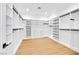 Spacious walk-in closet with custom shelving, drawers, and ample storage space at 6615 Whispering Sands Dr, Las Vegas, NV 89131