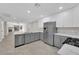 Modern kitchen with gray cabinets and stainless steel appliances at 7803 Canoe Ln, Las Vegas, NV 89145