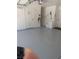 Clean garage features epoxy floors and ample storage space for vehicles and household items at 2504 Windjammer Way, Las Vegas, NV 89107