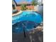 Sparkling swimming pool surrounded by a well-maintained yard; perfect for relaxation and outdoor entertaining at 2504 Windjammer Way, Las Vegas, NV 89107