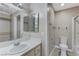 Well-lit bathroom featuring a vanity with a large mirror and a combination tub-shower at 4860 Nara Vista Way # 104, Las Vegas, NV 89103